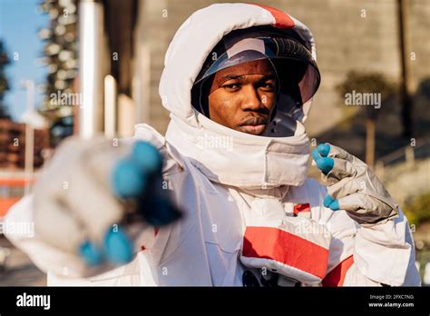 Male Astronaut Wearing Space Helmet Gesturing Stock Photo Alamy