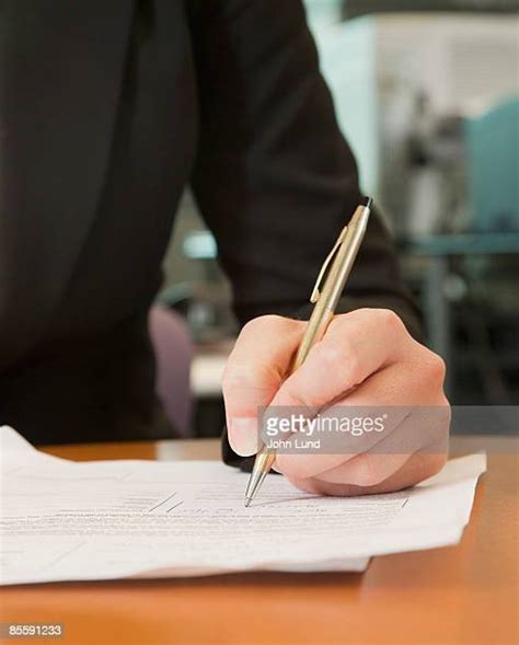 Black Hands Signing Paper Photos And Premium High Res Pictures Getty