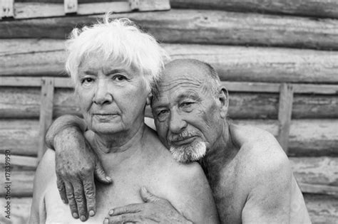Authentic Shot Of Aging Couple In The Russian Village Yard Bolded Tanned Man With Grey Beard