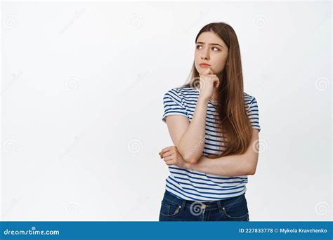 Young Woman Pondering Looking Left And Thinking Making Choice