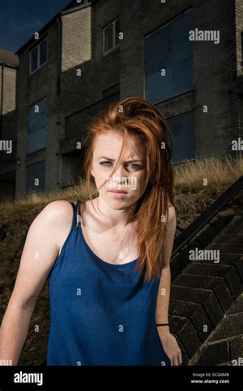 A Moody Defiant Scowling Angry Solo Redhead Ginger Haired Young Woman