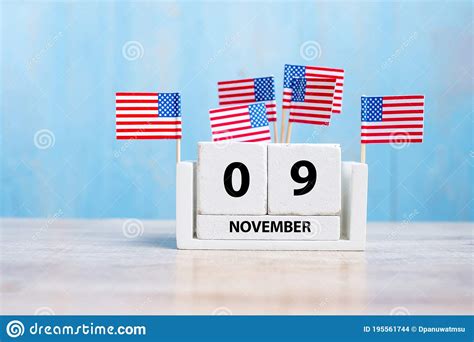 9 November Of White Calendar With United States Of America Flag On Wood