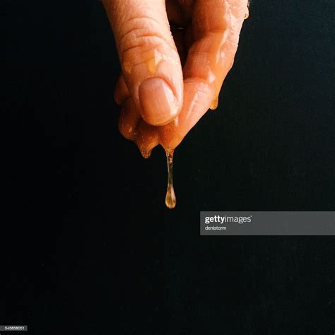 Hand Dripping With Honey Photo Getty Images
