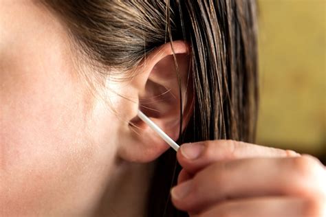 Premium Photo Woman Cleaning Ear With Cotton Swab Hygiene Ears
