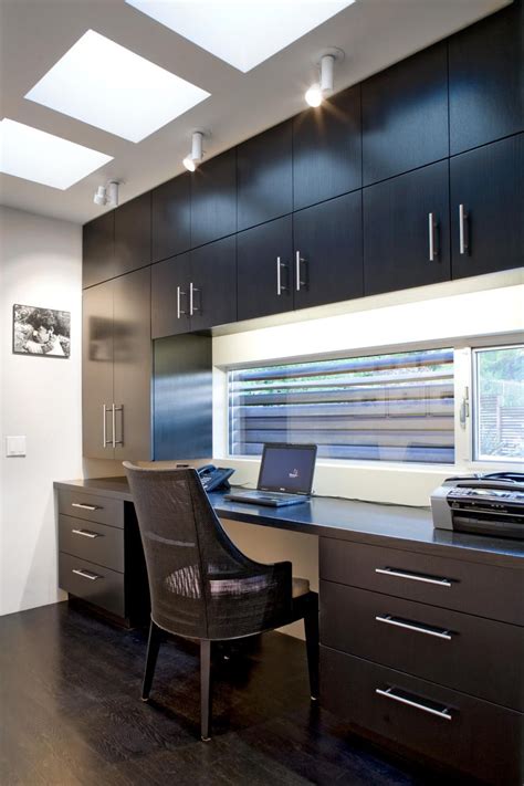 This Sleek Home Office Features White Walls Paired With Dark Brown Wood
