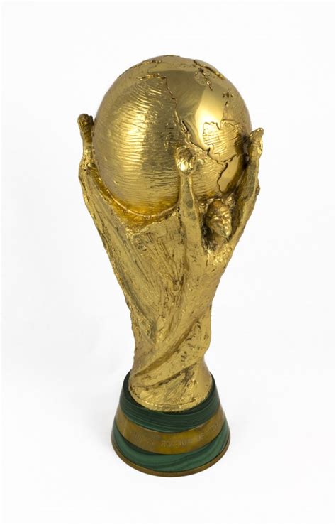 It stands 36.8 centimetres high, weighs 6.1 kilograms, is made of solid. Replica World Cup Trophy