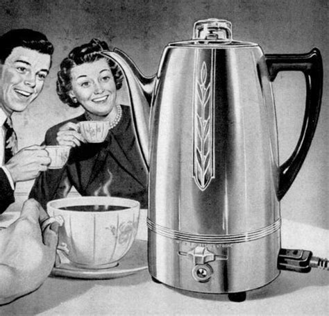 A Man And Woman Sitting Next To A Coffee Pot