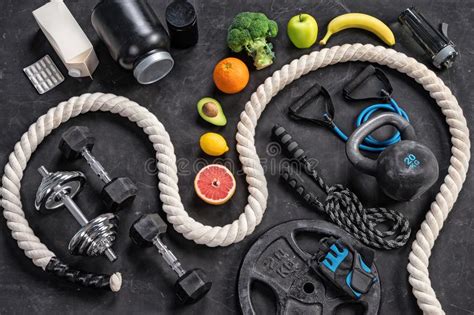 Sports Equipment And Healthy Nutrition On A Black Background Stock