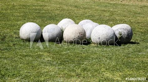 Round Stone Balls On The Green Grass Image Adobe Stock Green