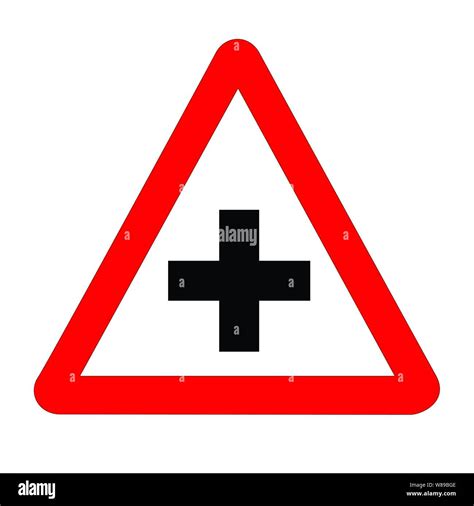 The Traditional Cross Roads Triangle Traffic Sign Isolated On A