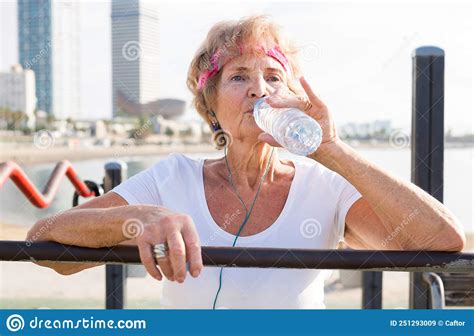Portrait Of Mature Sportswoman Drinking Water Stock Image Image Of Healthy French