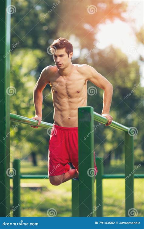 Well Built Muscular Man Doing A Physical Exercise Stock Photo Image
