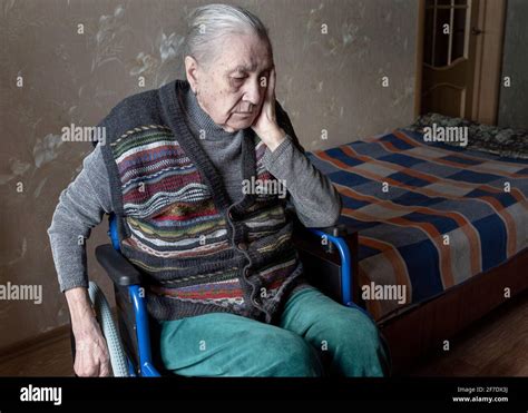 Portrait Of Sad Lonely Old Woman Sitting In A Wheelchair Old Age