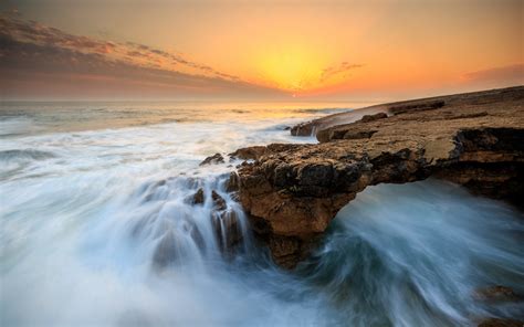 Download 1440x900 Wallpaper Sunset Sea Coast Rocks