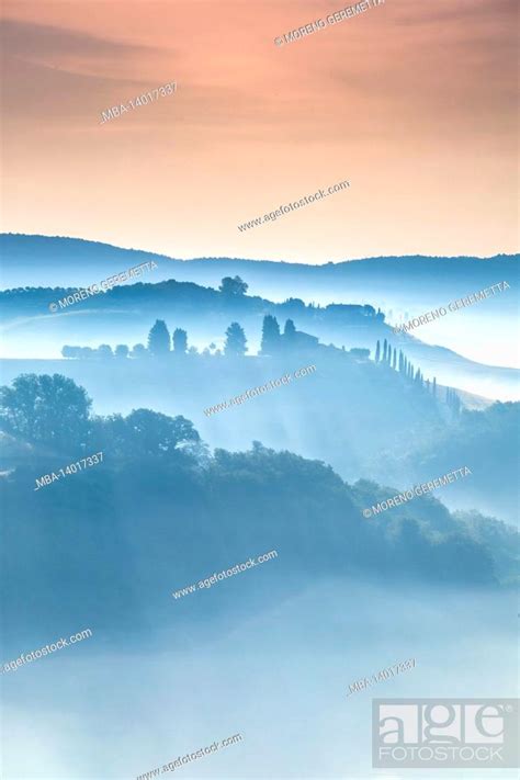 Tuscan Landscape Morning With Fog In The Valleys And Rolling Hills Of
