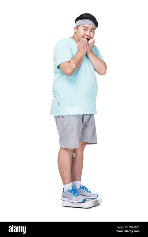 Obese Young Man Weight Measurement Stock Photo Alamy