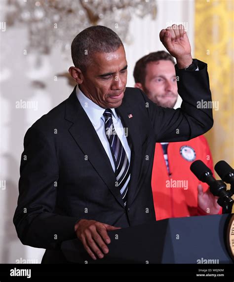 Us President Barack Obama Makes Victory Salute During A Welcoming