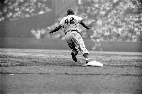 learn the full story of jackie robinson beyond these photos