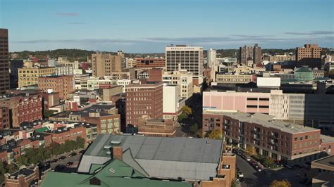 57k Stock Footage Aerial Video Of Descending Past Office Buildings