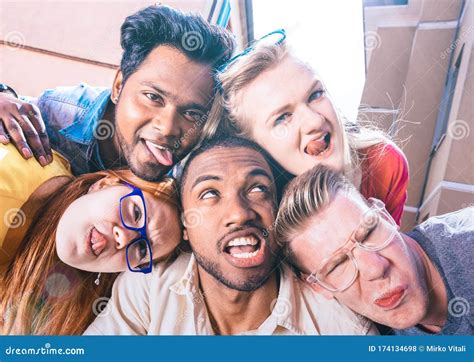 Multiracial Millenial Friends Taking Selfie Sticking Out Tongue With