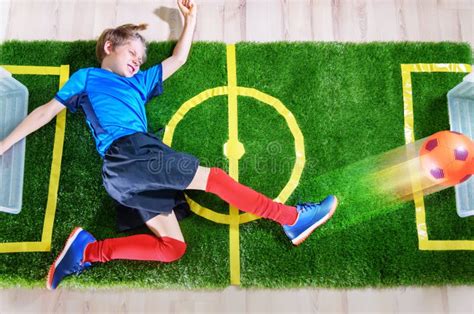 Boy Imitating Soccer Game Kicking The Ball On Green Stock Image Image