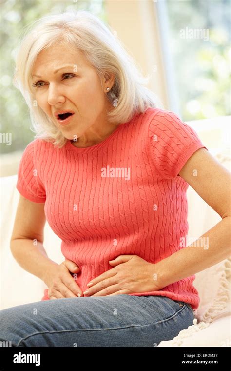 Mid Age Woman With Stomach Ache Stock Photo Alamy