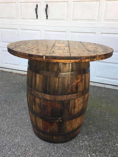 this is a 53 gallon jim beam whiskey barrel and a wire spool end that i converted into a