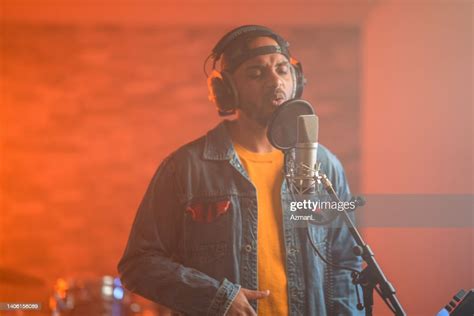 Young Hip Hop Singer Recording Music In Recording Studio High Res Stock