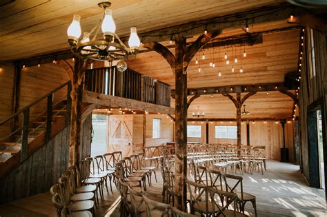 A Look At The Inside Of Our Heritage Barn Set Up With Cross Back Chairs For A Wedding Ceremony