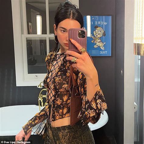 Dua Lipa Turns Up The Heat As She Flaunts Her Cleavage In A Racy Tie Up Top And Vinyl Trousers