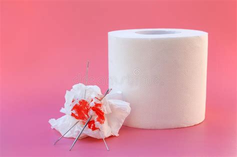 Toilet Paper And Blood Concept Of Hemorrhoid Treatment Stock Photo