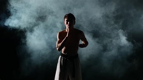 Man Training Taekwondo Isolated On Black Background Smoke Naked Torso Taekwondo Karate Stock