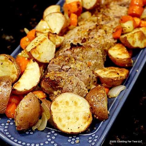 Cut each garlic clove into 6 slices. Roasted Pork Tenderloin with Potatoes and Carrots | Recipe ...