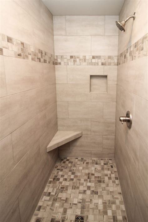 Beige Tiled Shower With Accent Tile Floor And Stripe Bathroom Shower