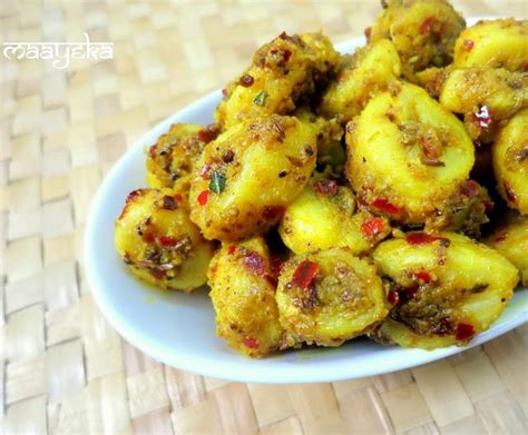 Using a fork dip each banana slice into to batter to coat it well and transfer it into oil and fry until it's golden brown. Raw Banana Stir Fry ,Kachchey Kele ki Sabzi, » Maayeka