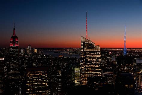 Download A Gorgeous New York Skyline Lit Up At Dusk Wallpaper