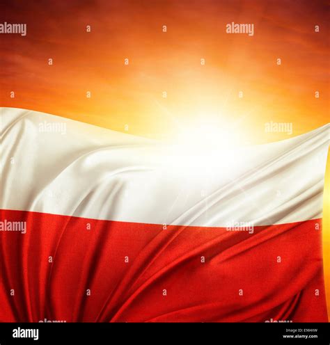 Polish Flag In Front Of Bright Sky Stock Photo Alamy