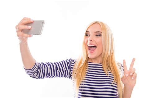 Premium Photo Happy Young Woman Making Funny Selfie With Two Fingers