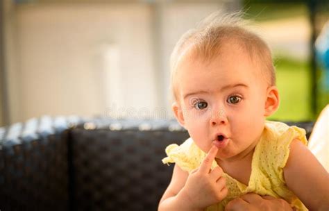Portrait Of Cute Baby Outdoors With Funny Expression Copy Space On
