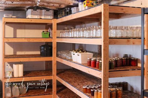 Since basements can be damp, metal shelving and cabinetry protect possessions better than wooden alternatives; DIY Basement Shelving - The Wood Grain Cottage