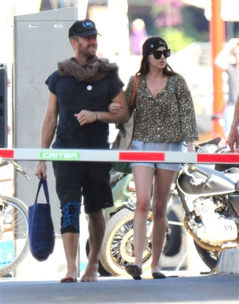 Dakota Johnson And Chris Martin Stroll Around Mallorca On Vacation Pics Hollywood Life