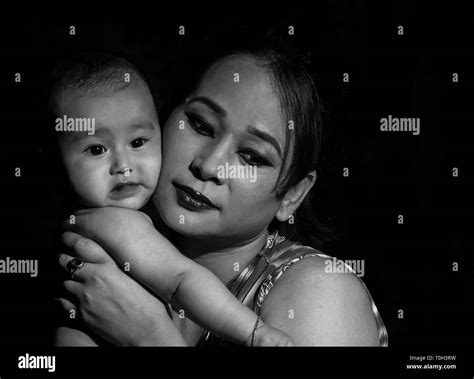 Infant And Her Mother Low Key Moody Portrait Stock Photo Alamy
