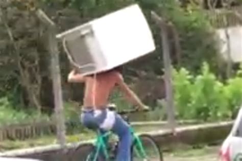 Brazilian Man Rides A Bike With A Fridgefreezer On His Backover