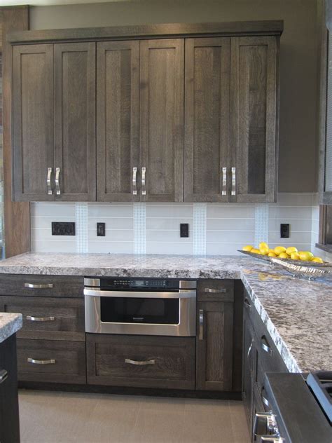 2 grey stained kitchen cabinet. really like the color of the cabinets - would like different backsplash and different hardware ...