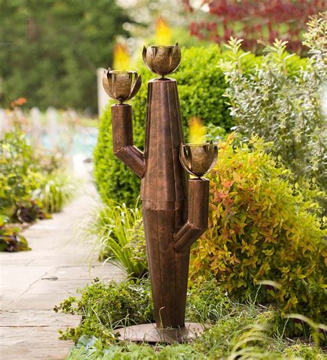 The metal is finished with a hand applied oxidation. Small Metal Cactus Outdoor Torch | Outdoor torches, Indoor ...