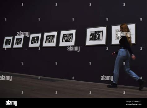 Employees pose during a press preview of ‘The EY Exhibition: Picasso