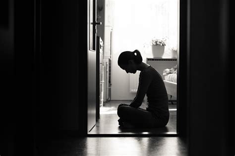 Depressed Girl Sitting In The Bedroom Stock Photo Download Image Now