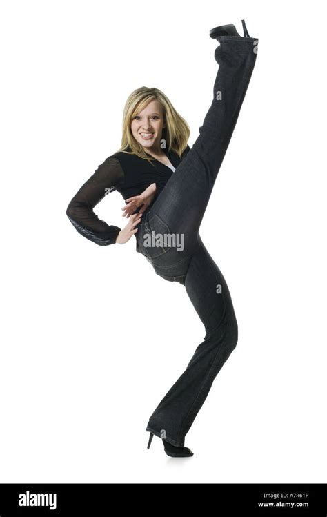 Woman Kicking Leg Up And Smiling Stock Photo Alamy