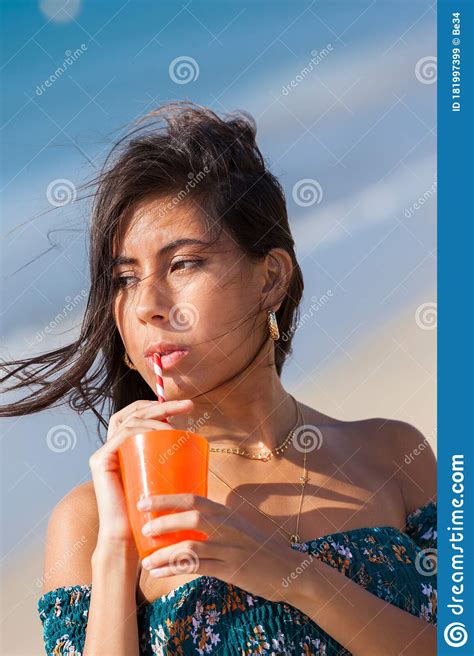 Young Woman Drinking Through Straw Stock Image Image Of Dress 1820
