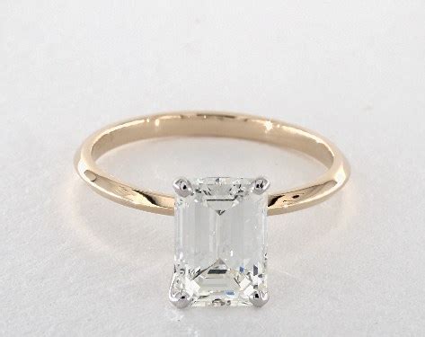 A striking 36.23ct fancy intense emerald cut yellow diamond ring from graff, cradled by brilliant diamond shoulders and set in platinum. 2.25 Carat Emerald Cut Solitaire Engagement Ring in 14K ...